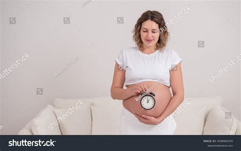 Pregnant Woman Naked Belly Holds Alarm Stock Photo 2208942255 Shutterstock