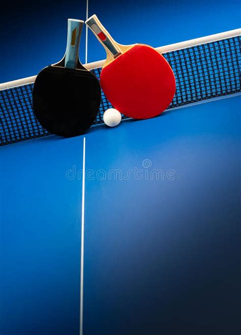 Ping Pong Rackets And Balls On A Blue Table With Net Stock Image