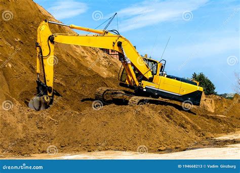 Yellow Excavator Working Digging In Sand Quarry Stock Image Image Of