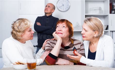 Two Mature Women Are Careing For Their Womanfriend Who Is Sad Stock Image Image Of Indoors