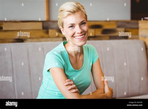 Pretty Blonde Woman Looking At Camera With Arms Crossed Stock Photo Alamy