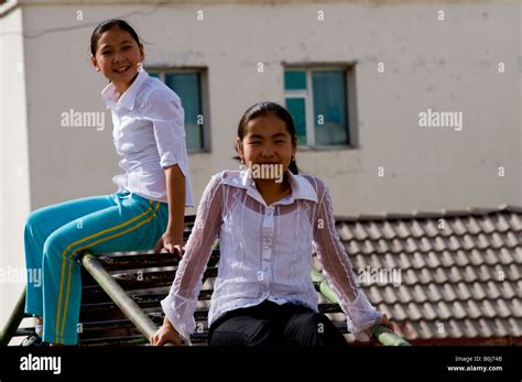 Mongolian School Children Enjoy The Autumn Sunshine At Their School