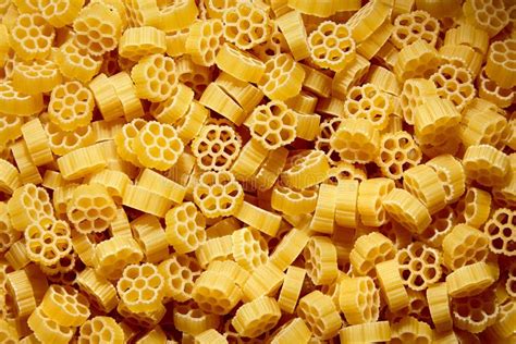 Raw Uncooked Rotelle Dry Italian Pasta Ruote Wagon Wheel Shape Stock