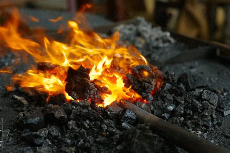 Red Hot Iron In The Blacksmith Fire By Stocksy Contributor Miquel Llonch Stocksy