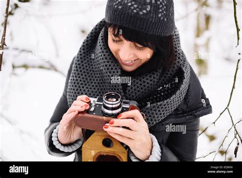 Beautiful Brunette Girl With A Vintage Camera Stock Photo Alamy