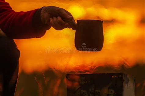 Beautiful Mature Woman Brews Coffee In A Turk In The Oven In Nature Stock Photo Image Of Food