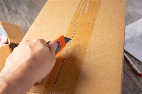 Hand Holding A Box Cutter Stock Image Image Of Improvement 30976659