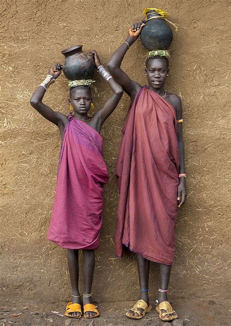 Portrait Of Bodi Tribe Women Carrying Jars Of Milk On Their Heads Hana