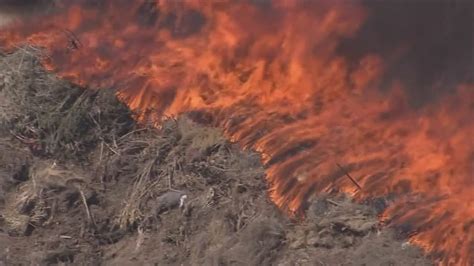 Fire crews continue to put out fire near Loop 202 in Mesa | 12news.com