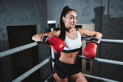 Premium Photo Fit Sexy Strong Brunette Woman In Sportswear Top And Shorts In Boxing Gloves In
