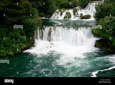 Croatian Holidaymaker Enjoying Swimming In The Spectacular Waterfalls