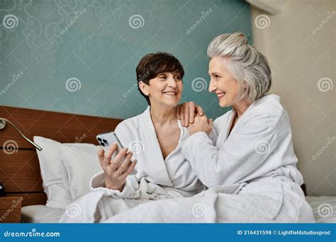 A Senior Lesbian Couple In Robes Stock Photo Image Of Loving Care