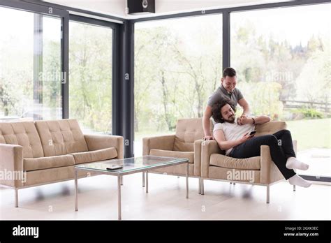 Gay Couple Love Home Concept Gay Couple Enjoying Leisure Time In Living Room Stock Photo Alamy