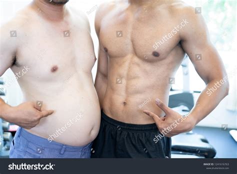 Two Naked Men Comparing Belly Fat Stock Photo Edit Now 1241616763