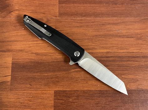 QSP Knives Phoenix Flipper Knife D2 Reverse Tanto Blade Black G10