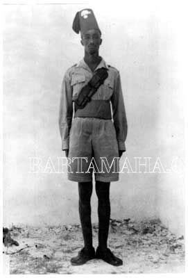 An Old Black And White Photo Of A Man In Uniform With A Hat On His Head