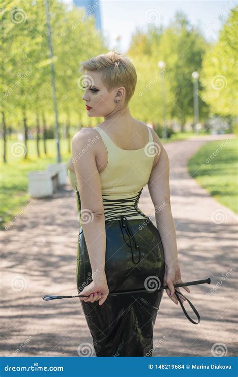 Hot Curvy Woman With Short Hair And Big Boobs Wearing Latex Kinky Secretary Dress With Feitsh