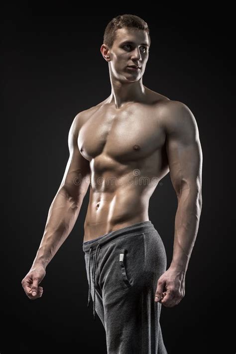 Very Muscular Man Posing With Naked Torso In Studio Stock Image Image Of Pectoral Athlete