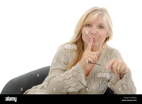 Mature Woman Put A Finger To Her Lips Stock Photo Alamy