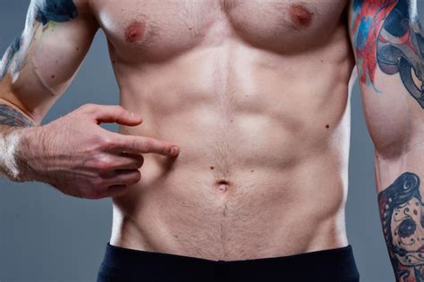 Premium Photo Athlete With Cubes On His Stomach Press Pumped Up Torso Muscles Tattoos Nude View