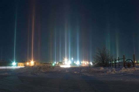 light pillars phenomenon shining lights   sky  snow