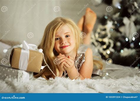 Portrair Of Pretty Blonde Girl Is Near Decorated Xmas Tree Stock Photo Image Of Baby Blonde