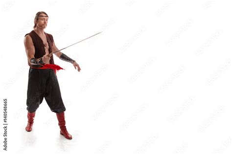 Actor Athlete Man In Trousers With Naked Torso Posing With A Chinese Sword On A White Background