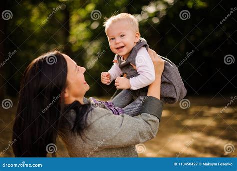 Happy Brunette Mother Playing With A Laughing Baby Daughter Stock Image Image Of Lifestyle