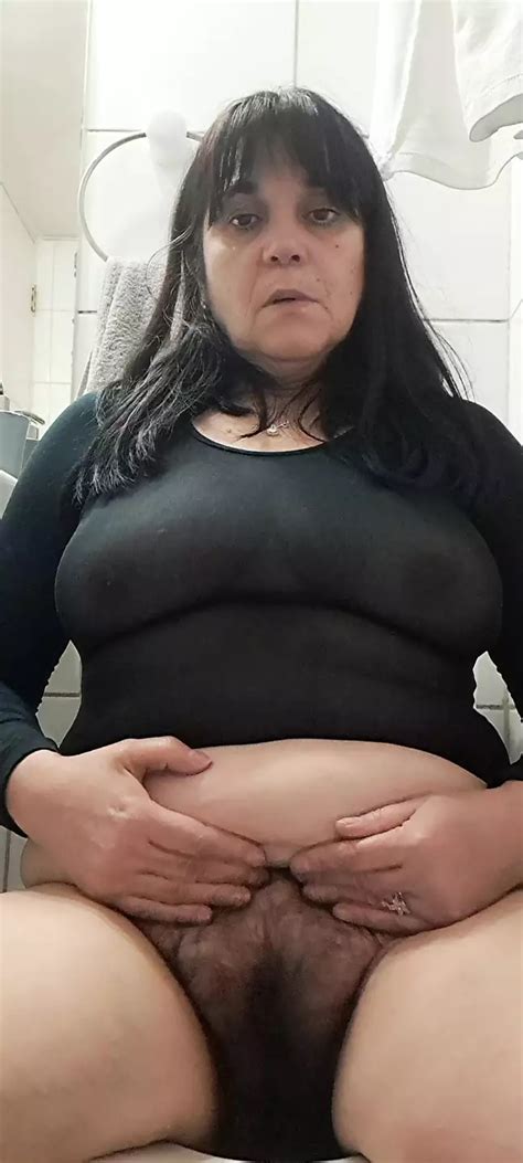 Mature MILF Shows Tits In Black Transparency Below The Hairy Black XHamster
