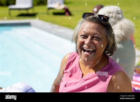 Senior Woman Sunbathing Pool Hi Res Stock Photography And Images Alamy
