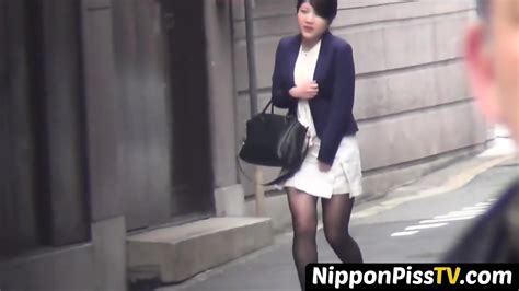 Japanese Beauty Plays With Her Shaved Pussy While Peeing Openly