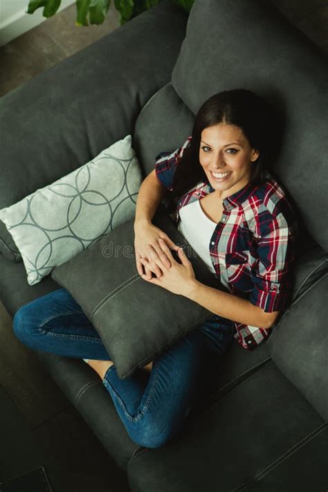 Cool Brunette Girl Sitting On The Sofa Stock Photo Image Of Horizontal Lifestyle 81245272
