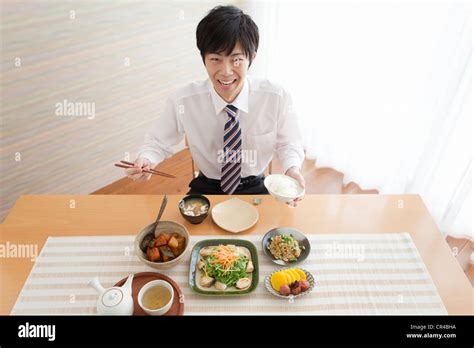 Young Man Having Breakfast Stock Photo Alamy