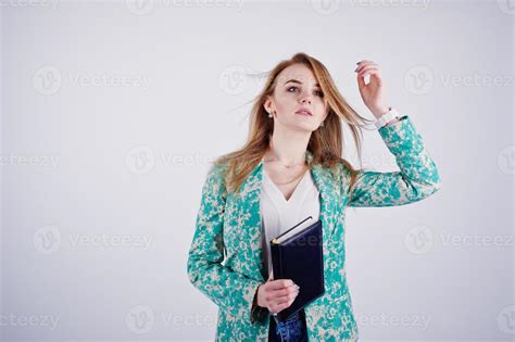 Stylish Blonde Girl In Jacket And Jeans With Notebook Diary At Hands Against White Background On