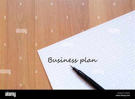 Blank Notebook And Ink Pen On A Wooden Desk Stock Photo Alamy