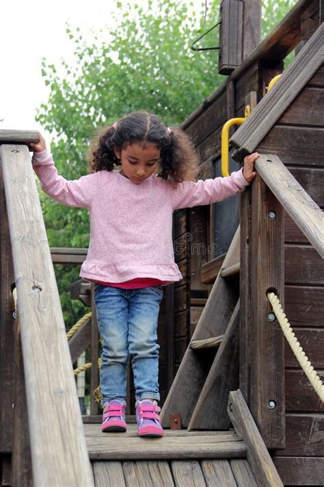 3 Year Old Brunette Latina Girl Plays With Toy Letters And Numbers To Improve Her Language