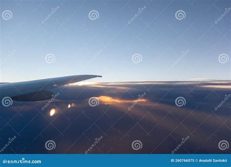 Airplane Flight Aircraft S Wing And Land Seen Through The Illuminator