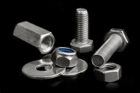 Chrome Bolts and Nuts Isolated on Black Stock Photo - Image of service ...
