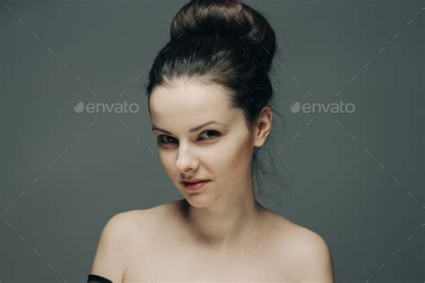 Pretty Brunette On Gray Background Naked Shoulders Clean Skin Cosmetology Stock Photo By Shotprime