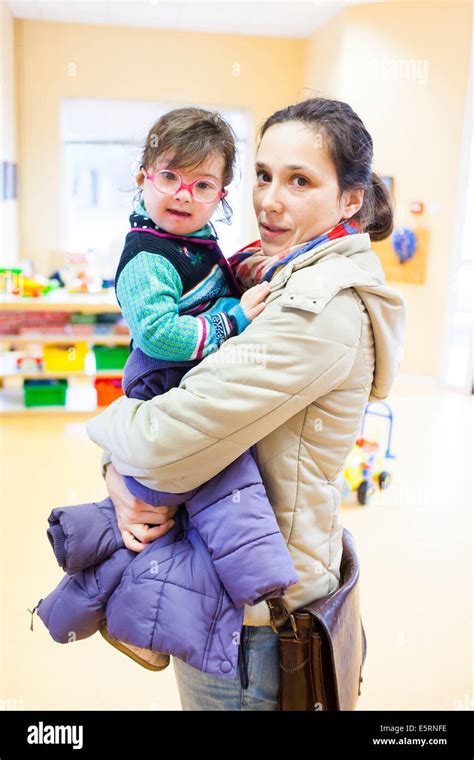 2 And A Half Year Old Girl With Downs Syndrome With Her Mother Stock