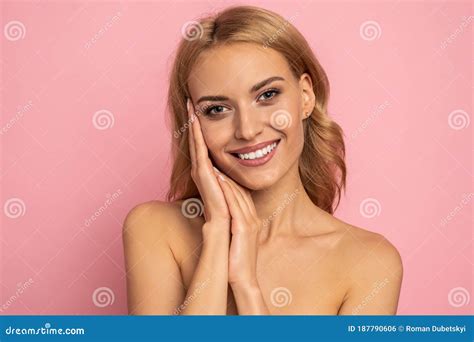 Image Of Adorable Half Naked Woman Smiling At Camera And Touching Her Face Isolated Over Pink