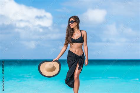 Elegant Beach Woman In Bikini And Fashion Sarong Standing On Shore Sexy Lady In Black Beachwear