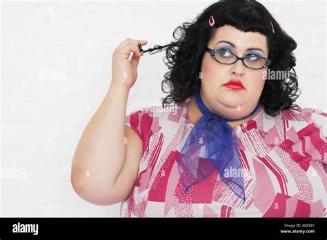 Overweight Woman Twisting Strand Of Hair Portrait Stock Photo Alamy