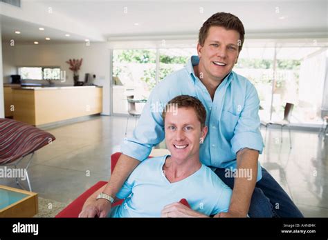 Gay Couple Relaxing On Couch Stock Photo Alamy