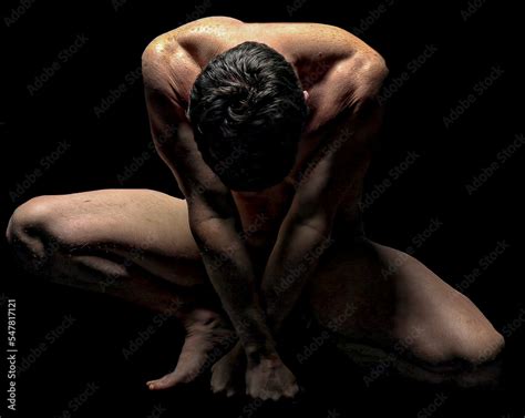 Artistic Nude Male Athletic Model Posing Naked Accenting Muscular Definition With Black