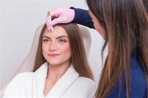 Premium Photo Woman Wearing Bathrobe In Beauty Clinic Aesthetics Patient Cosmetic Procedures