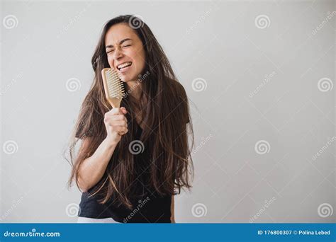 Woman Brushes Her Long Hair With Wooden Hairbrush Stock Image Image