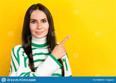 Photo Of Adorable Sweet Woman Wear Striped Sweater Smiling Pointing Finger Empty Space Isolated