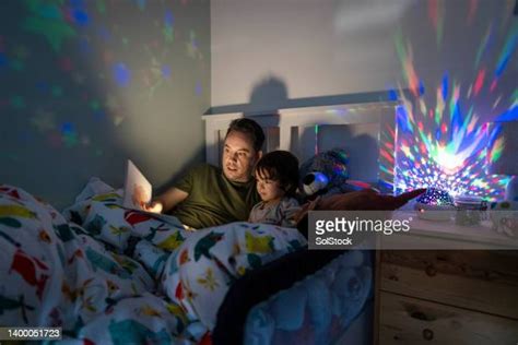 463 Boy Reading A Book In Bed At Night Stock Photos, High-Res Pictures ...