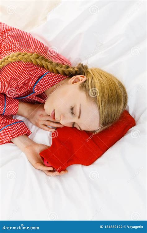Woman Sleeping With Warm Red Hot Water Bottle Stock Photo Image Of Relaxation Pain 184832122
